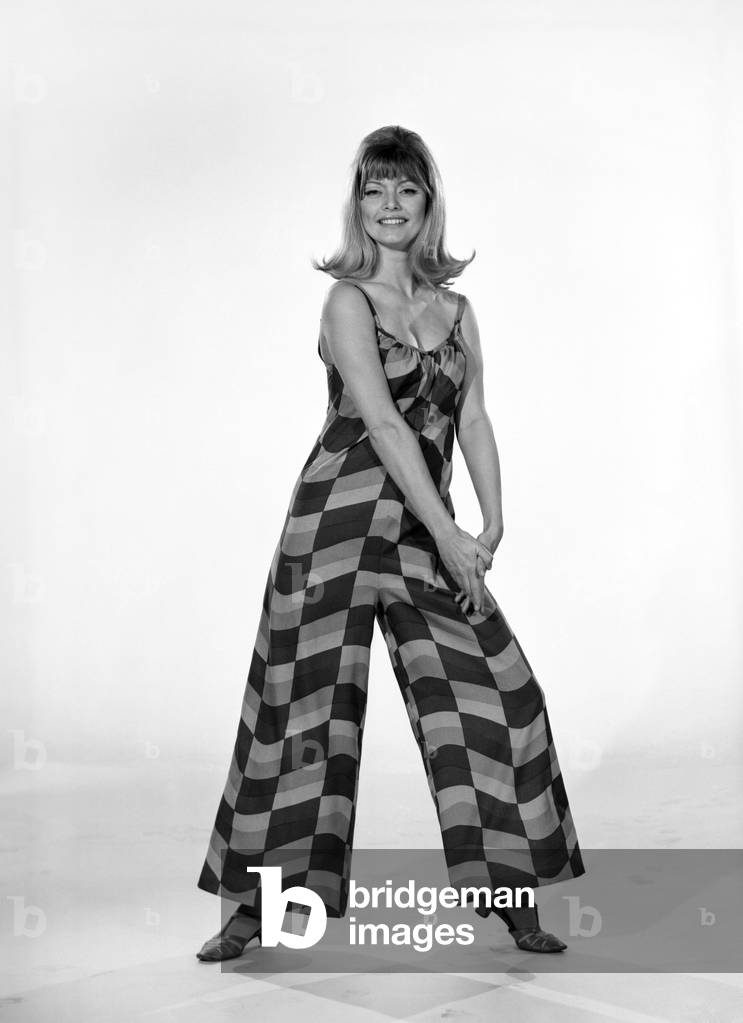 Uschie Bernell modelling beach dress/trouser in Reveille Studios 1965 (b/w photo)