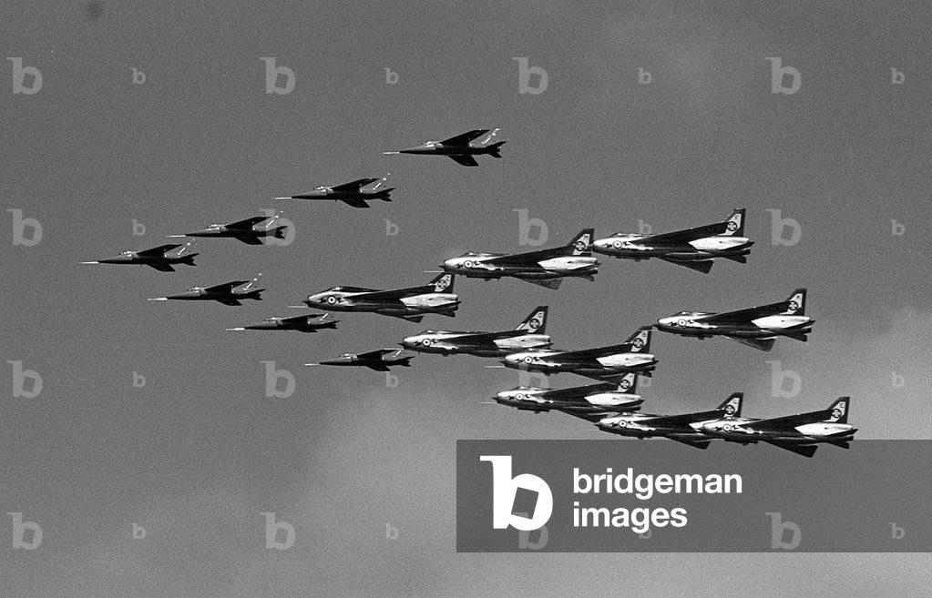 Aircraft English Electric Lightning F3's and Hawker Siddeley Gnat T1's fly in a, 12 ship formation as they prepare for a flying display at the Paris Air Show 1965 (b/w photo)