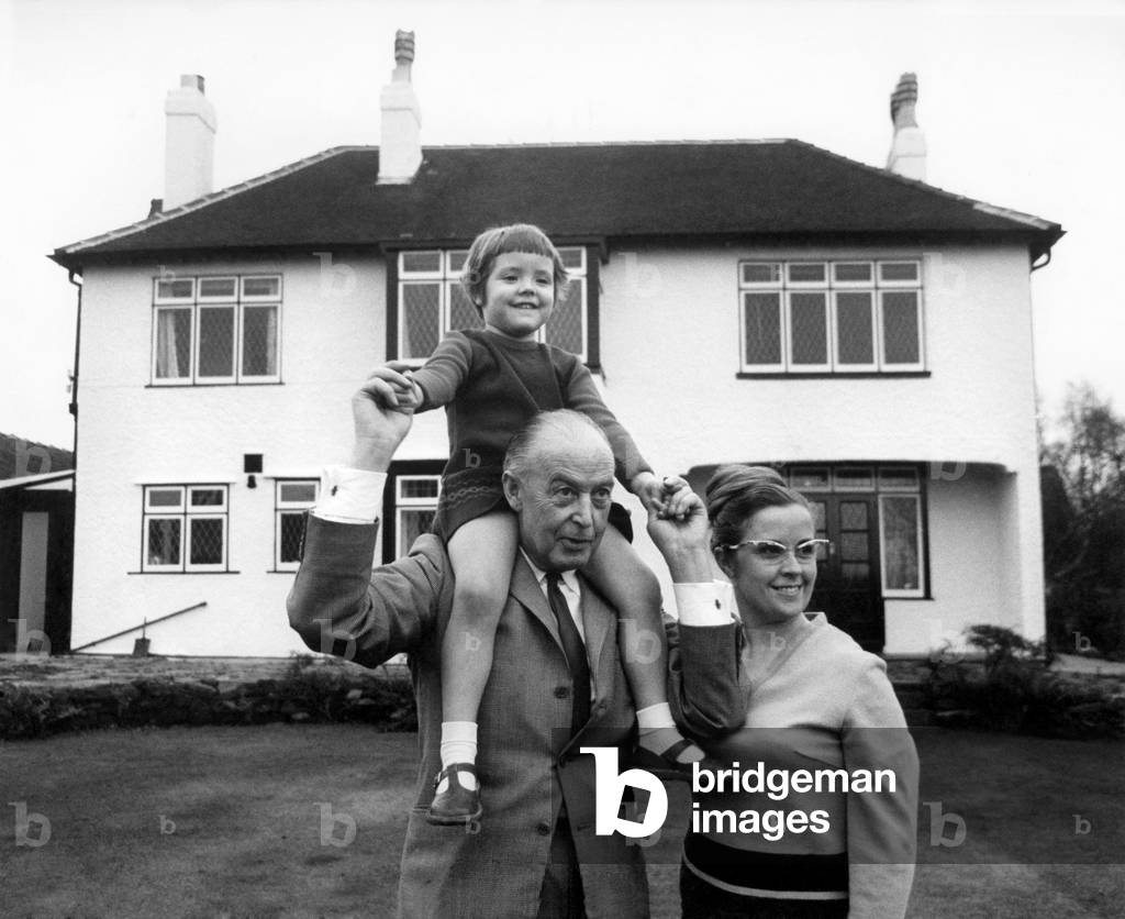 The newly weds Mr. James McCartney father of Paul and 2nd wife Angela and 4 year old Ruth in the grounds of their home in Wirral, November 1964 (b/w photo)