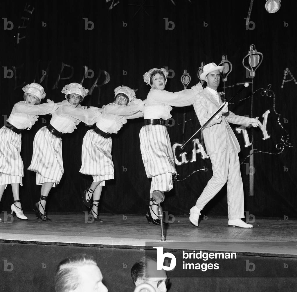 Kay Kendall left, performing with ( left to right) Margaret Leighton, Julie Wilson, Joyce Grenfell and Ian Carmichael during rehearsals for the 'Night Of 100 Stars' charity performance at the London Palladium. 22nd July 1958 (b/w photo)