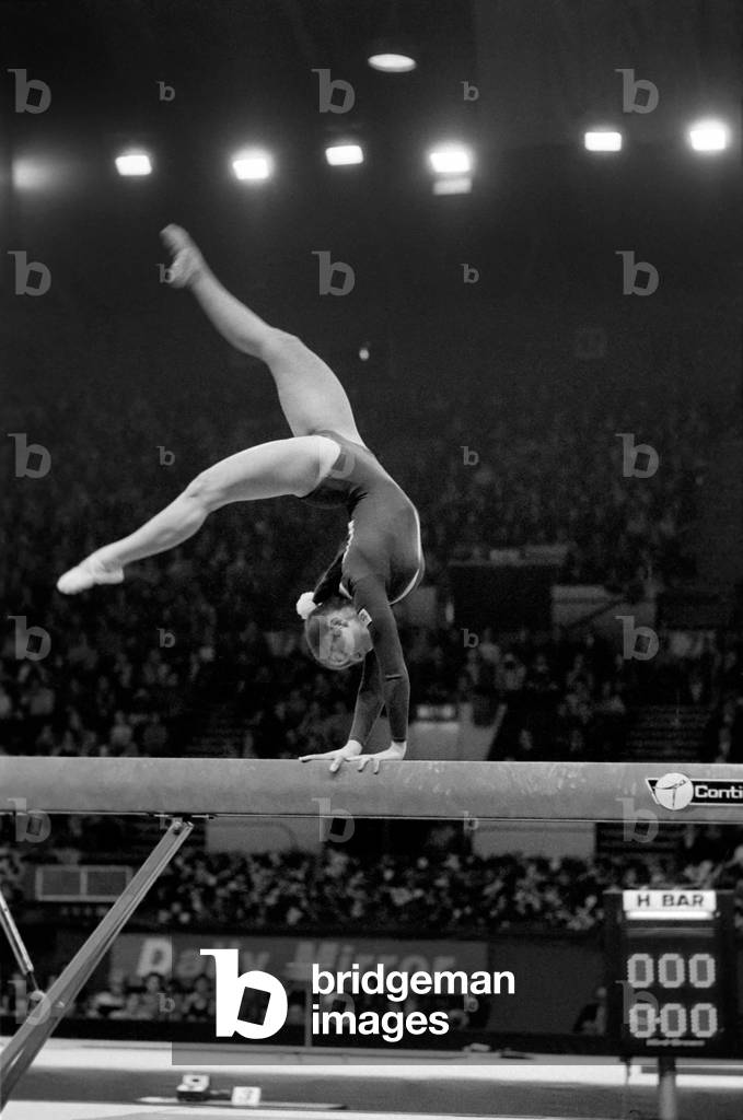Competitor on the beam in the 