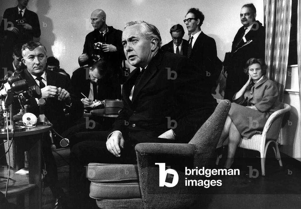 Harold Wilson former Labour Prime Minister of Britain at press conference at London Airport after his return from Rhodesia with wife Mary 1965