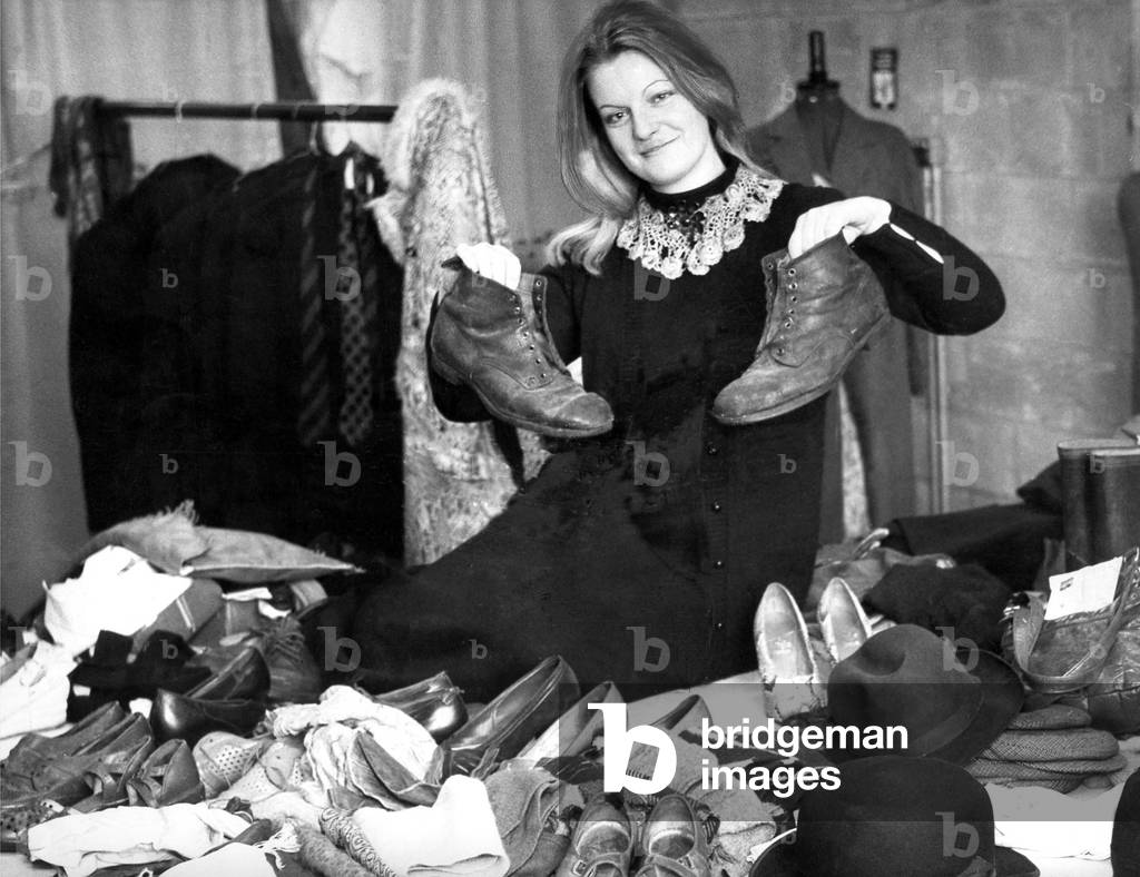 These boots were made for walking for the right price at this local jumble sale in May 1979 (b/w photo)