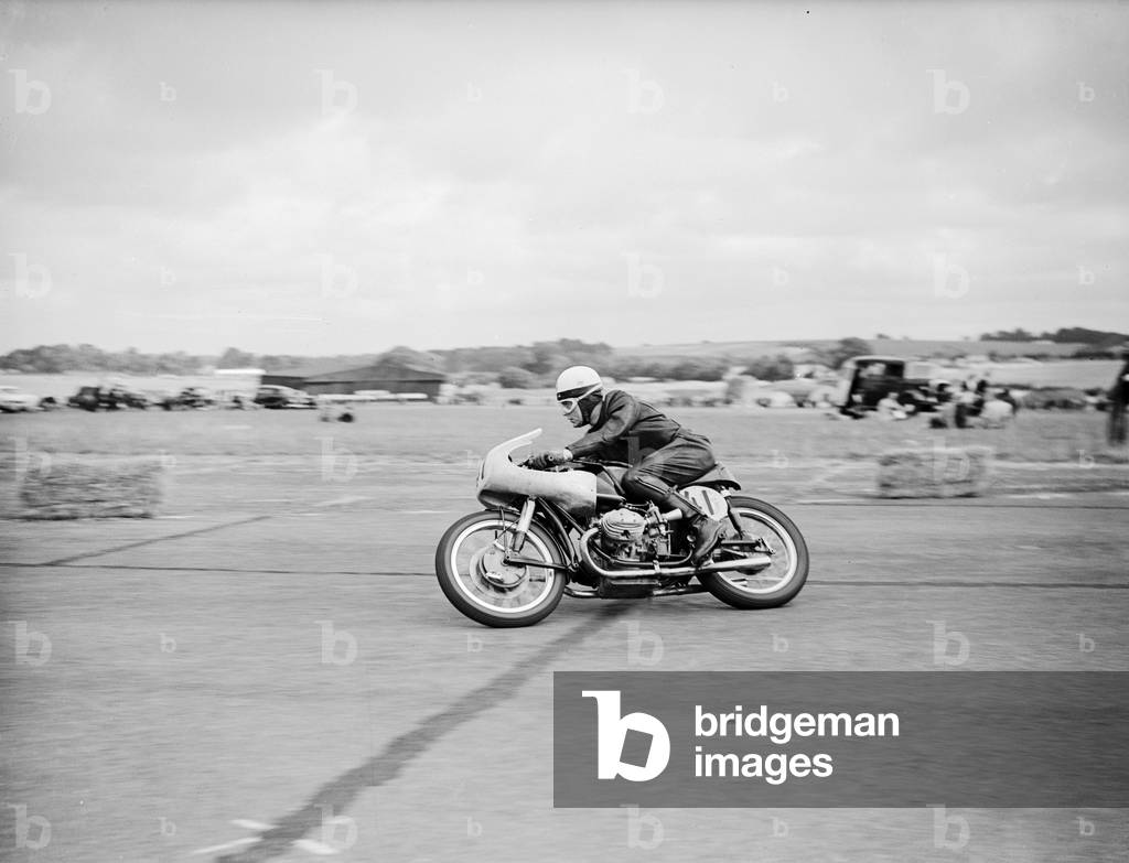 Action from the Daily Herald Motor Cycle Racing Championship at Thruxton. 4th August 1958 (b/w photo)