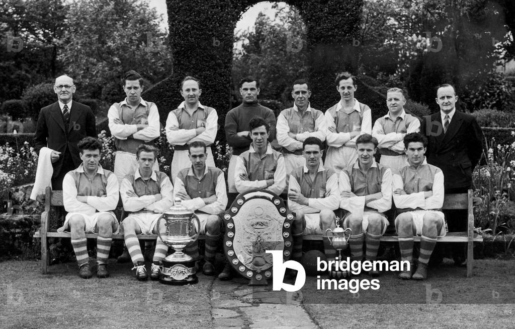 Alvechurch football club team group with trophies after winning the Redditch and District League championship, the A. E. Terry Memorial Cup as well as the Studley Charity Cup, c.1948 (photo)
