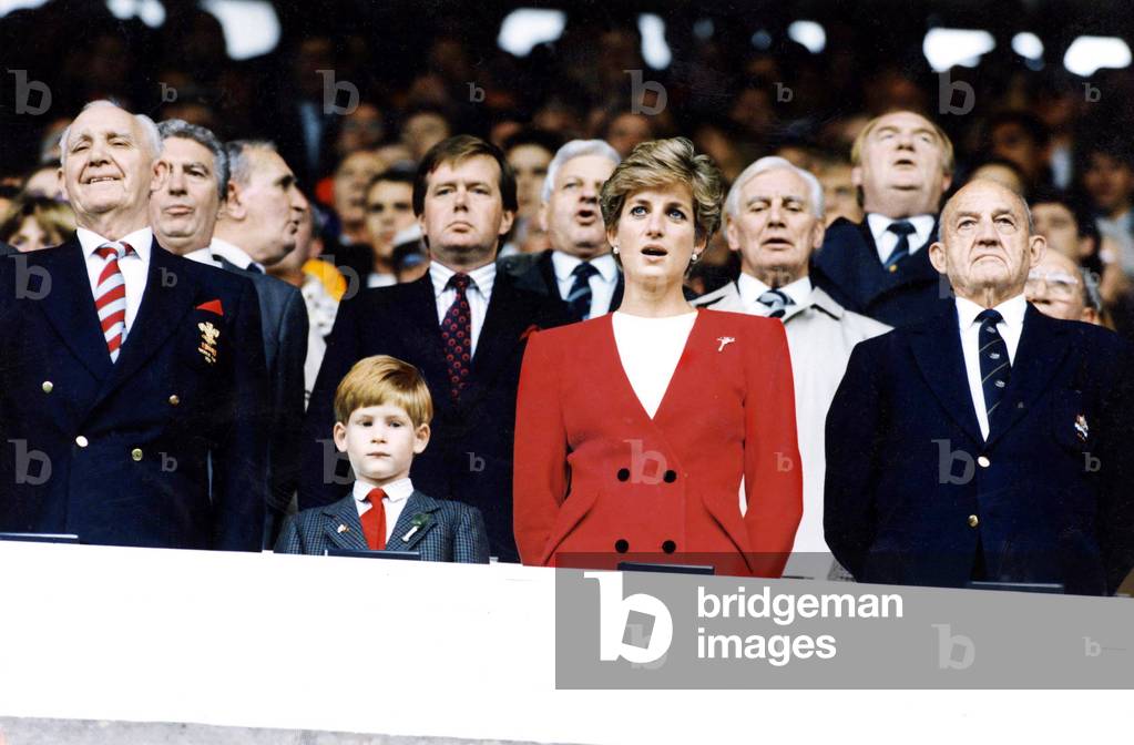 Diana, Princess of Wales joins in singing of the national anthem at Cardiff Arms Park with Prince Harry - 14th October 1991