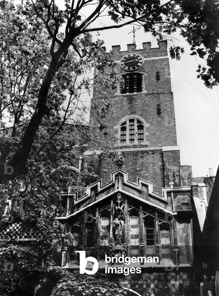 The tower of a church in London seen through the trees. August 1936