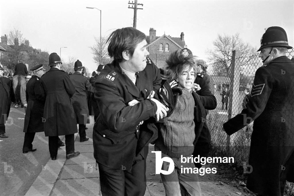 Police arrest protesting students in Talbot Road behind White City, who have gathered in a demonstration against the visit of the South African rugby team and the apartheid system. November 1969