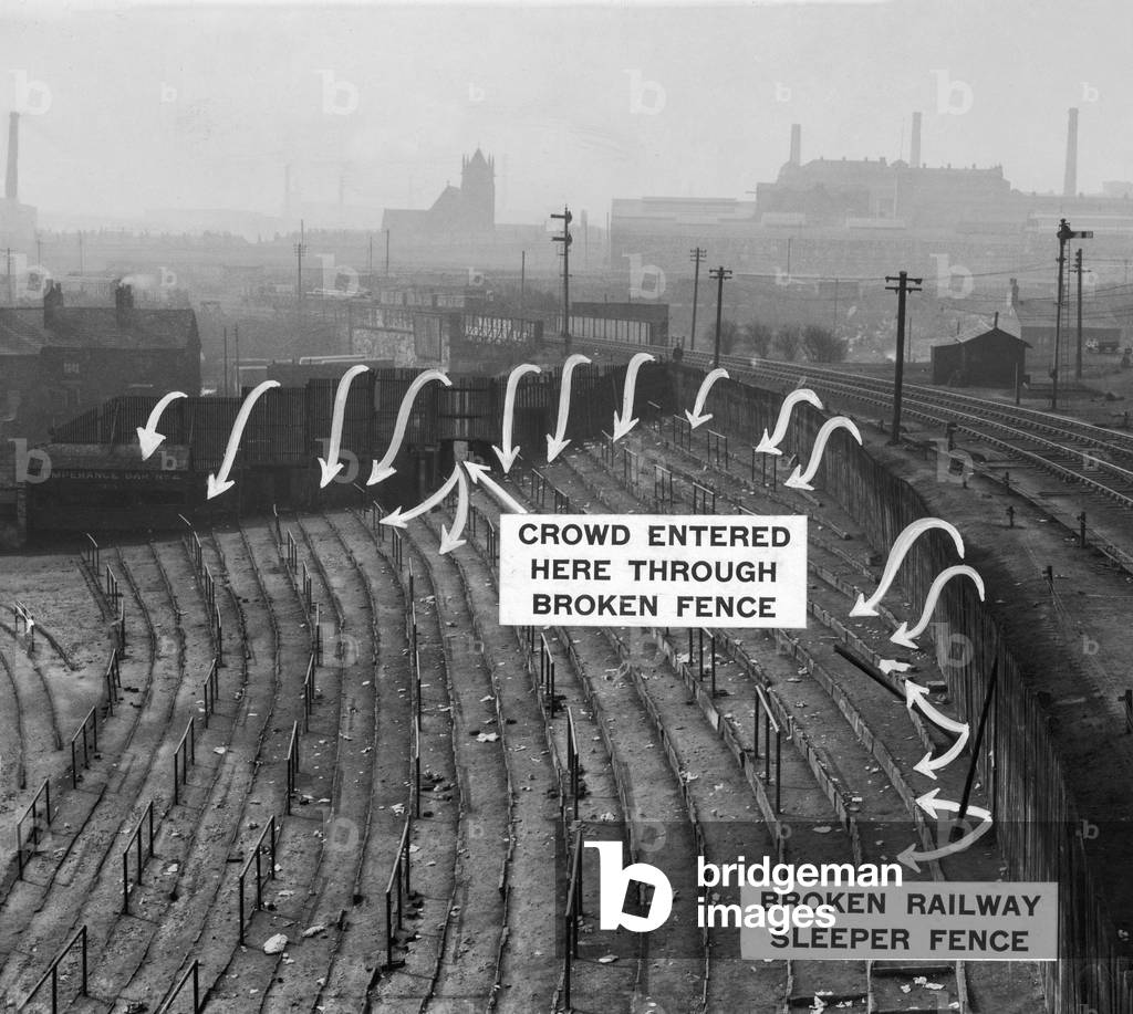 On 9 March 1946, crowd congestion led to 33 Bolton Wanderers F. C. spectators losing their lives through asphyxiation and hundreds suffering injuries in a crowd estimated to be in excess of 85,000 people, whilst watching their team take on Stoke City F. C. in the Sixth Round second-leg of the FA Cup. Photo-diagram showing how the crowd entered the stadium from the railway embankment to swell the number already packed in the stands (photo)