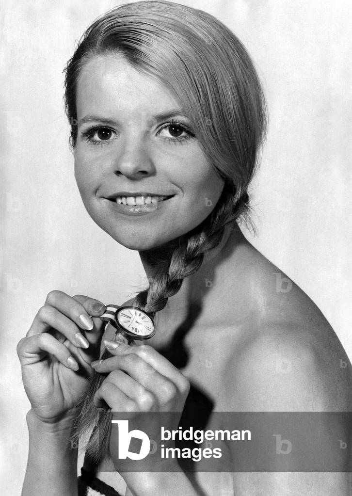 Strap-In-Time. Buckle to. Here is a cute way to tie back your bonny locks. Get a jazzy watch strap-- then get a couple more, June 1969 (b/w photo)