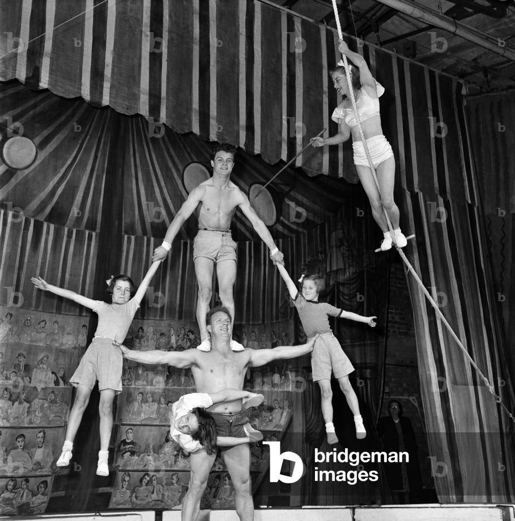 Entertainment Circus: A member of the Paulo family seen here performing the human Pendulam. September 1953
