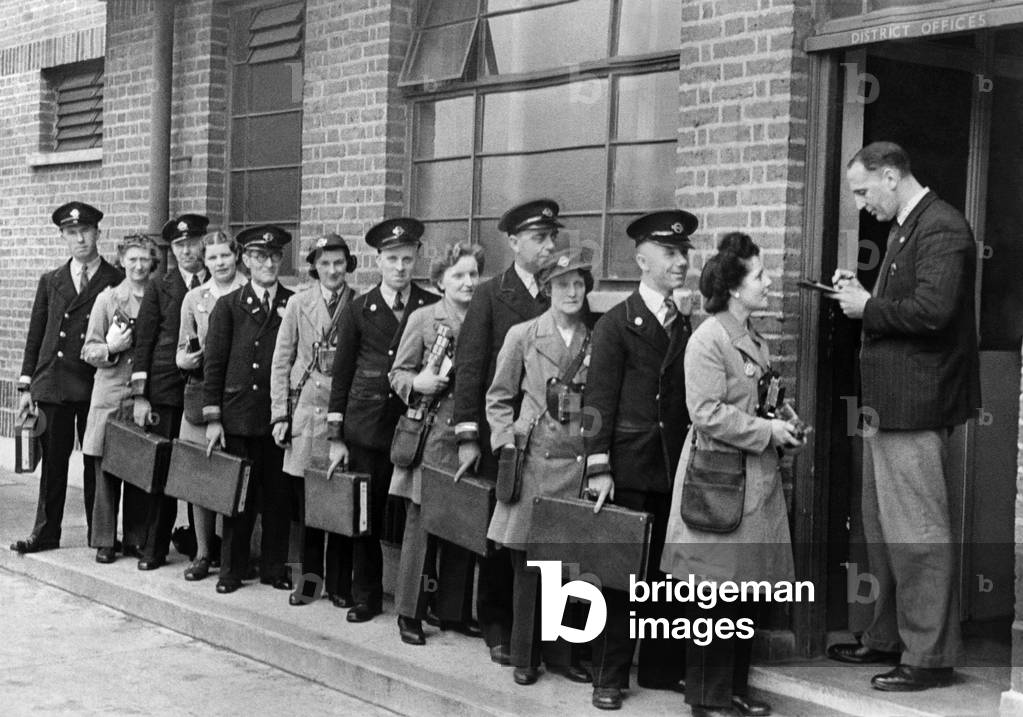 Husband and wife bus crews check in at the depot at North Fleet. From right to left: Mr. and Mrs. William Reader, Mr. and Mrs. Walter Coole, Mr. and Mrs. Fred Annal, Mr. and Mrs. Ernest Fifield, Mr. and Mrs. James Nolan, Mr. and Mrs. John Cox. May 1944