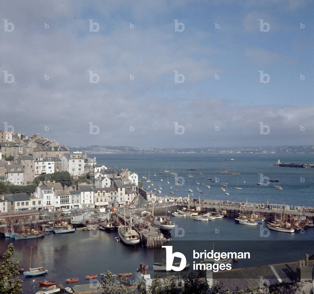 Aerial view of the small fishing town of Brixham, in Torbay, part of the English Rivieira on the South Devon coast. 1963.