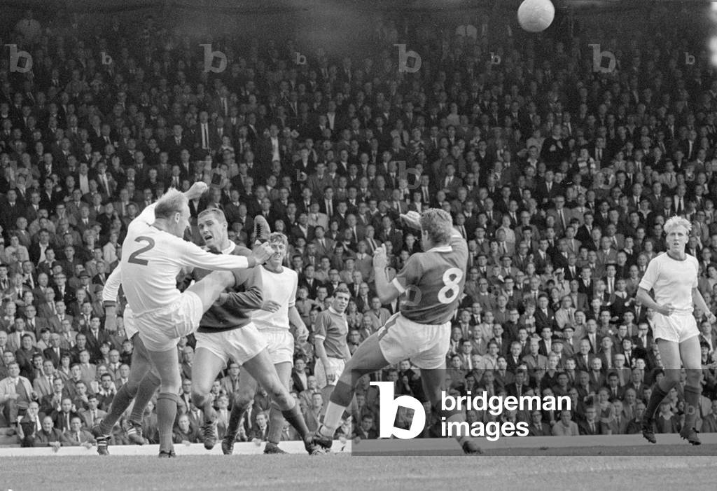 Arsenal defender Don Howe clears the ball from the goal line and harrased goalkeeper Jim Furnell during their English league division one match against Liverpool at Anfield. The match was the first match to be broadcast on Match of the Day on BBC2 and was won 3-2 by Liverpool August 1964 (photo)