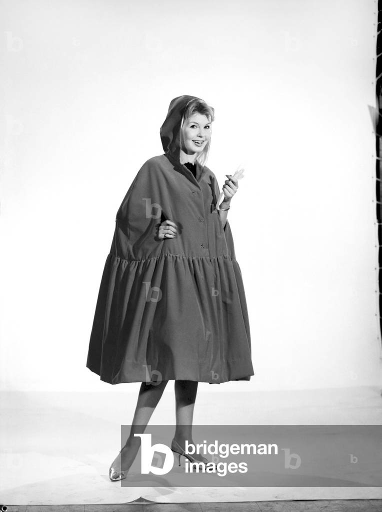 Little Red Riding Hood : Model Elizabeth Duke wearing red velvet cape, 1963 (b/w photo)