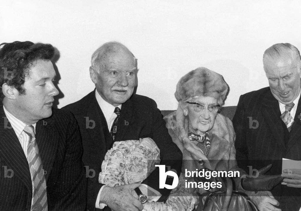 Dame Agatha Christie with her grandson, husband and impresario, Peter Saunders, November 1973 (b/w photo)
