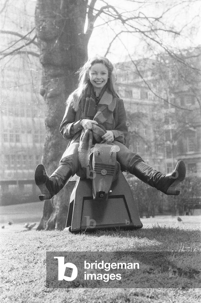 Actress Lalla Ward who will join Dr Who in the long running TV series. Lalla will be the Doctor's 11th girl assistant and the second actress to play the Time Lady Romana (Romanadvoratrelundar) in Doctor Who. After a guest appearance as Princess Astra in the Doctor Who story The Armageddon Factor in 1979, Ward was chosen to replace Mary Tamm, who has decided against continuing in the role. Lalla is seen here posing with K9 the Doctors dog.6th February 1979 (b/w photo)