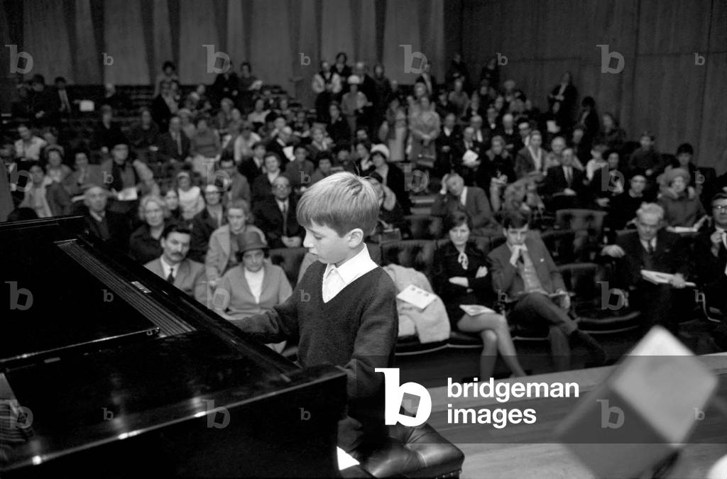 The biggest national event in the world of young pianists for two years, the Final of the National Junior Piano Playing Competition 1969, sponsored by the British piano makers, was held at the Purcell Room of the Royal Festival Hall this morning. 
The winner in the Junior section, 9 year old Francis Rayner from Glamorgan pictured playing an encore after being awarded the first prize. 
December 1969