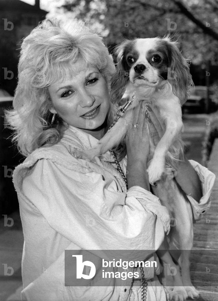 Actress: Debbie Arnold with dog. November 1984