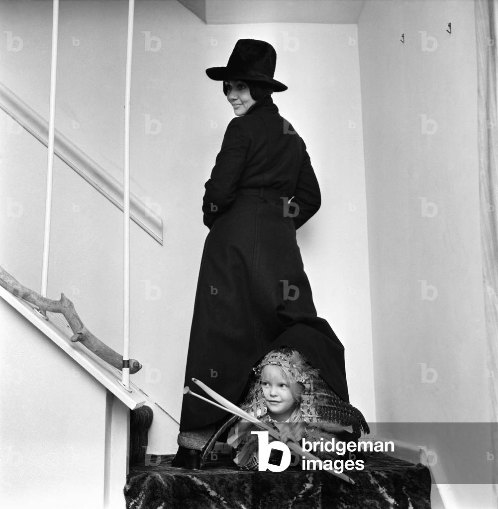 Clothing fashion. Model Ann Coates wearing a maxi coat. December 1969