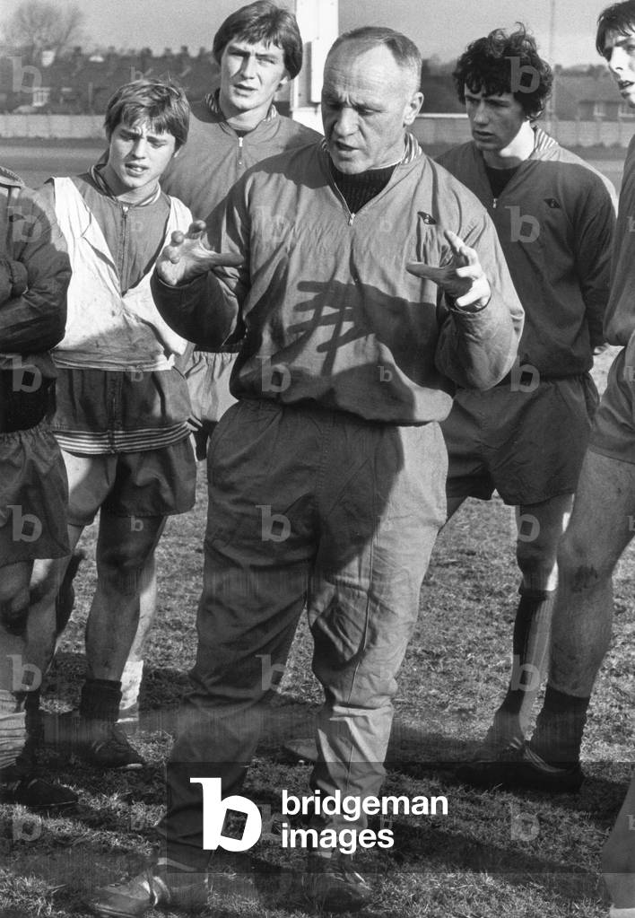 Liverpool manager Bill Shankly gives instructions to some of his players during a training session, c.1966 (photo)