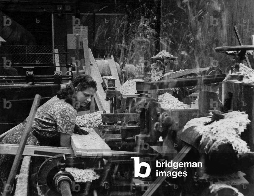 Girls in saw mills now doing work of men. 
July 1941