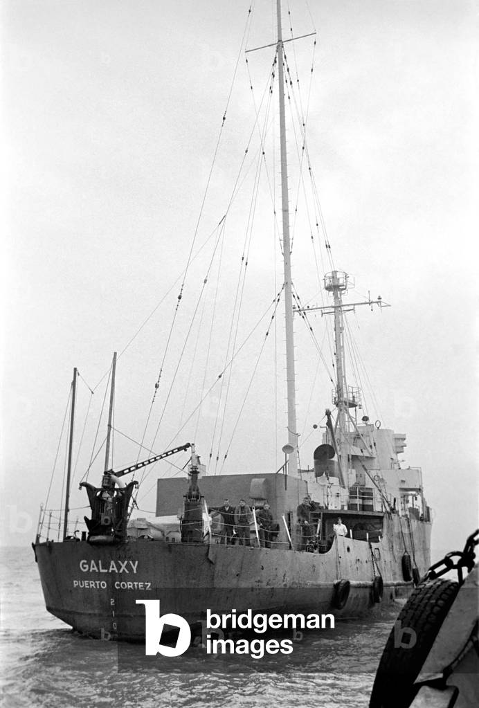 Radio London: Pirate Radio Station. General scene around the Motor Vessel Galaxy which is home to Radio London. Whilst the disc jockeys broadcast to the nation, the skipper ensures that they keep 12 miles off shore, the chef prepares a meal and the technicians ensure that equipment is working, 1965 (b/w photo)