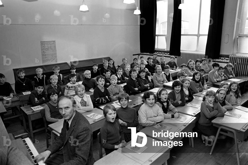The children of Peel Park Junior School, Accrington, who went on holiday to Bournemouth this year, and were said to be the nicest bunch of children to go there. 
The children singing in class. 
November 1969