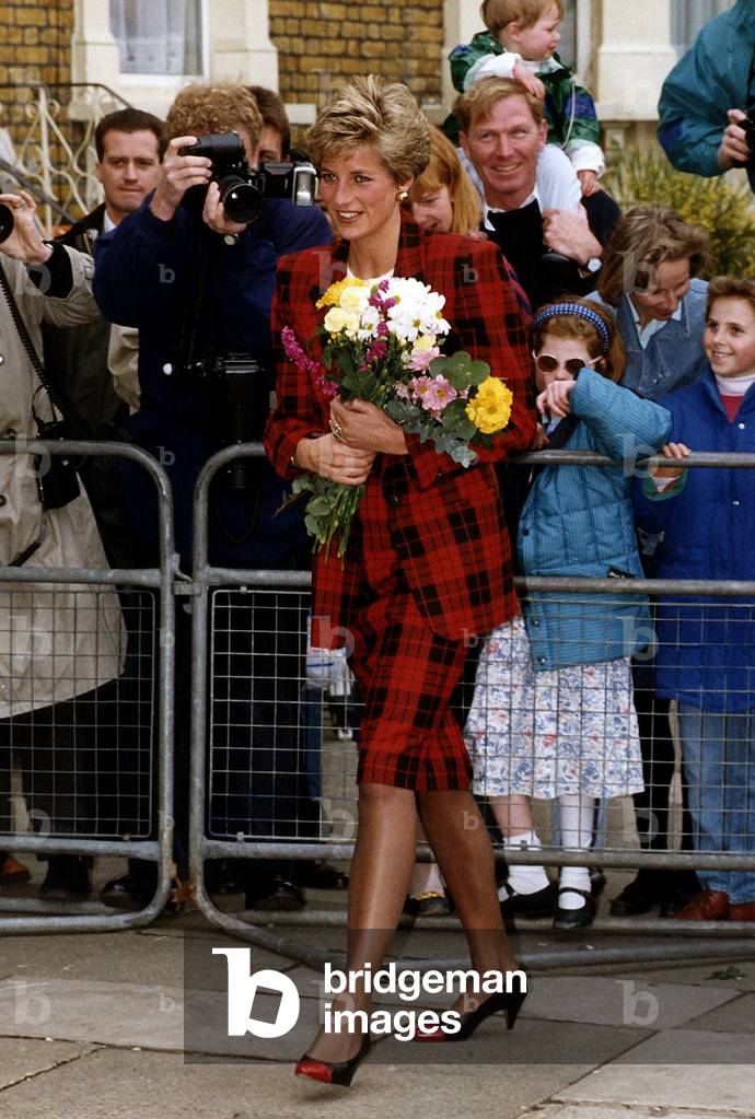 Princess of Wales on a walkabout wearing red and black check suit and carrying a bunch of flowers, May 1991