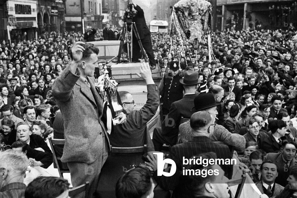 The Derby County team return home with the FA Cup trophy following their victory over Charlton Athletic in the Final at Wembley. Picture shows: Derby captain Jack Nicholas showing off he trophy. 1st May 1946 (photo)