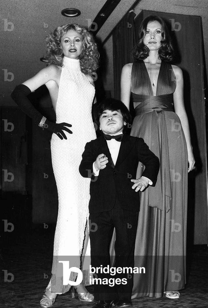 Britt Ekland actress with Maud Adams and Herve Villechaize at premiere of The Man With The Golden Gun in 1974 (b/w photo)
