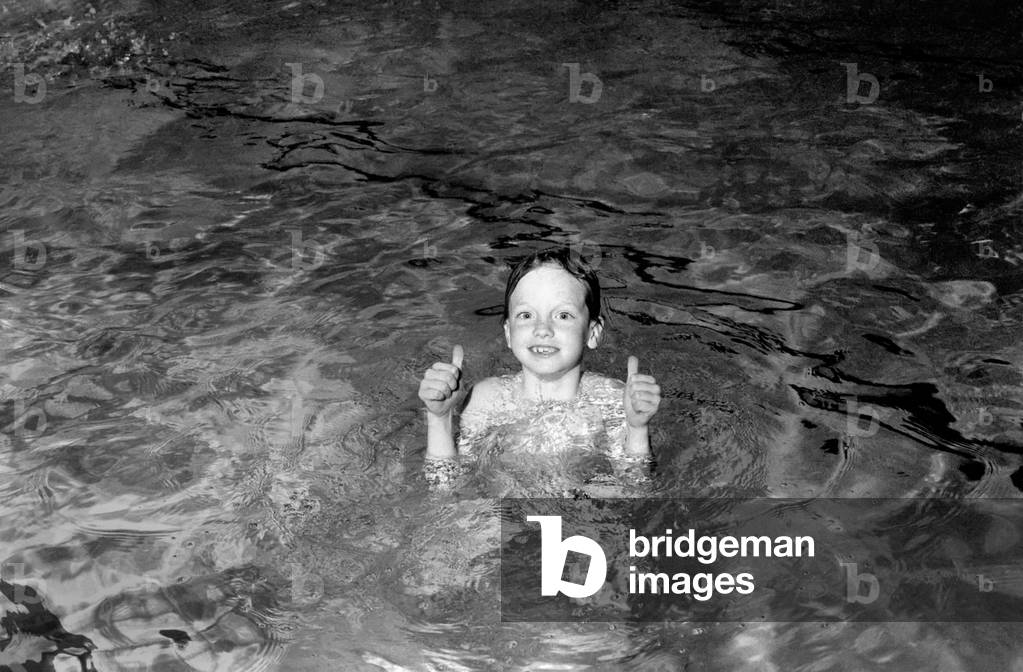 7 year old Alexander Nice who is a member of the Dover Lifeguard Club, at a Dover swimming pool, April 1975 (b/w photo)
