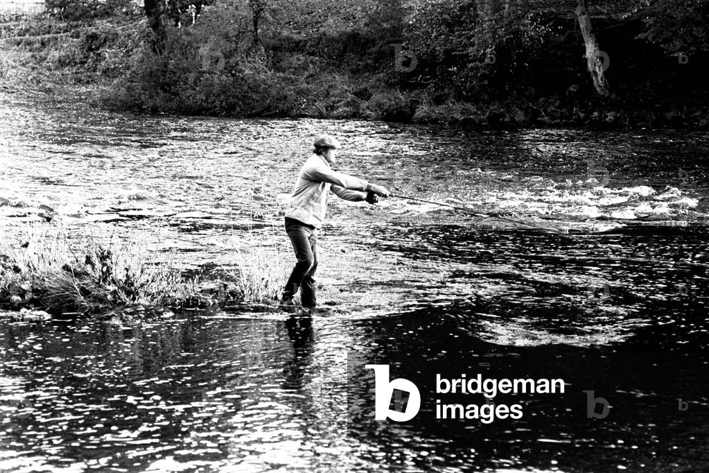Filming of an episode of 'Whatever Happened To The Likely Lads' fishing in the North Tyne near Haughton Castle situated to the north of the village of Humshaugh, Northumberland. Pictured is actor James Bolam. 23rd October, 1973 (b/w photo)