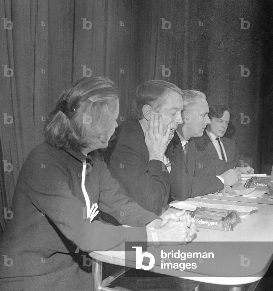 Kenneth Tynan (second in from left) taking part in a debate on censorship after swearing on television on a Saturday night programme, 1965 (b/w photo)