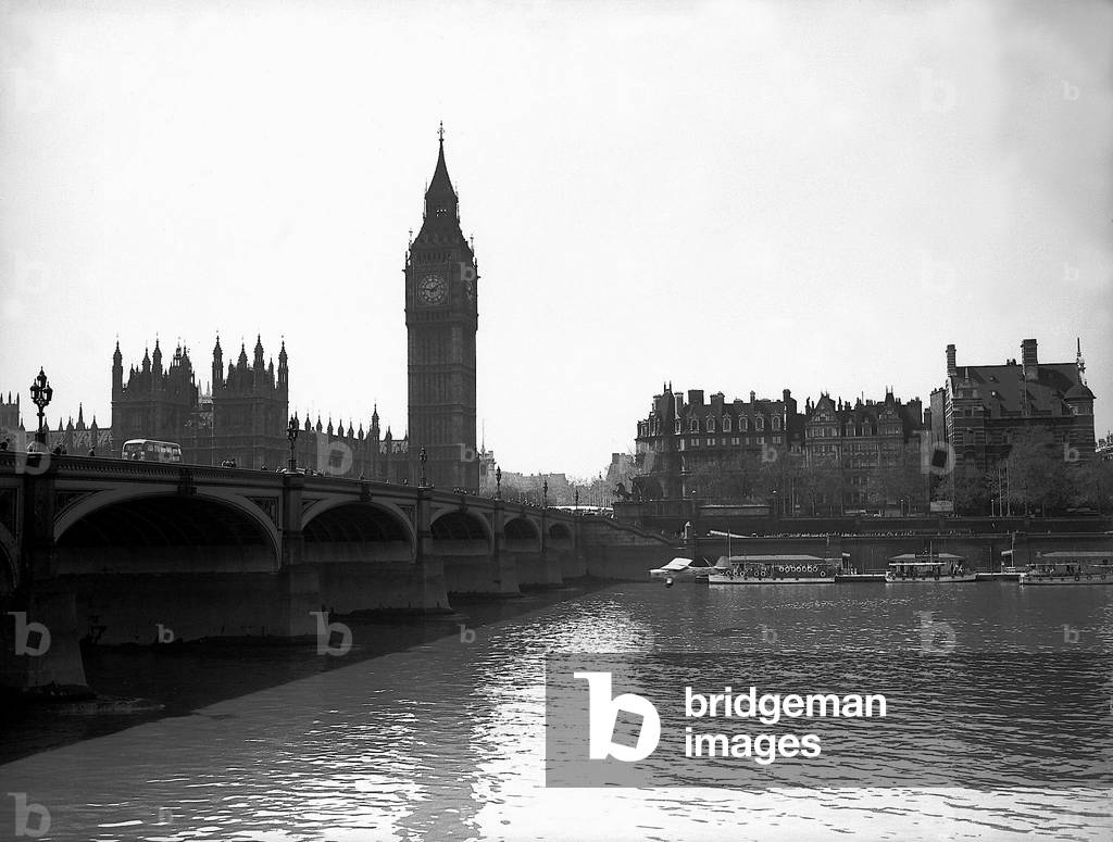 Mad Major Christopher Draper flying under Westminster Bridge in an Auster aircraft. May 1953 (b/w photo)