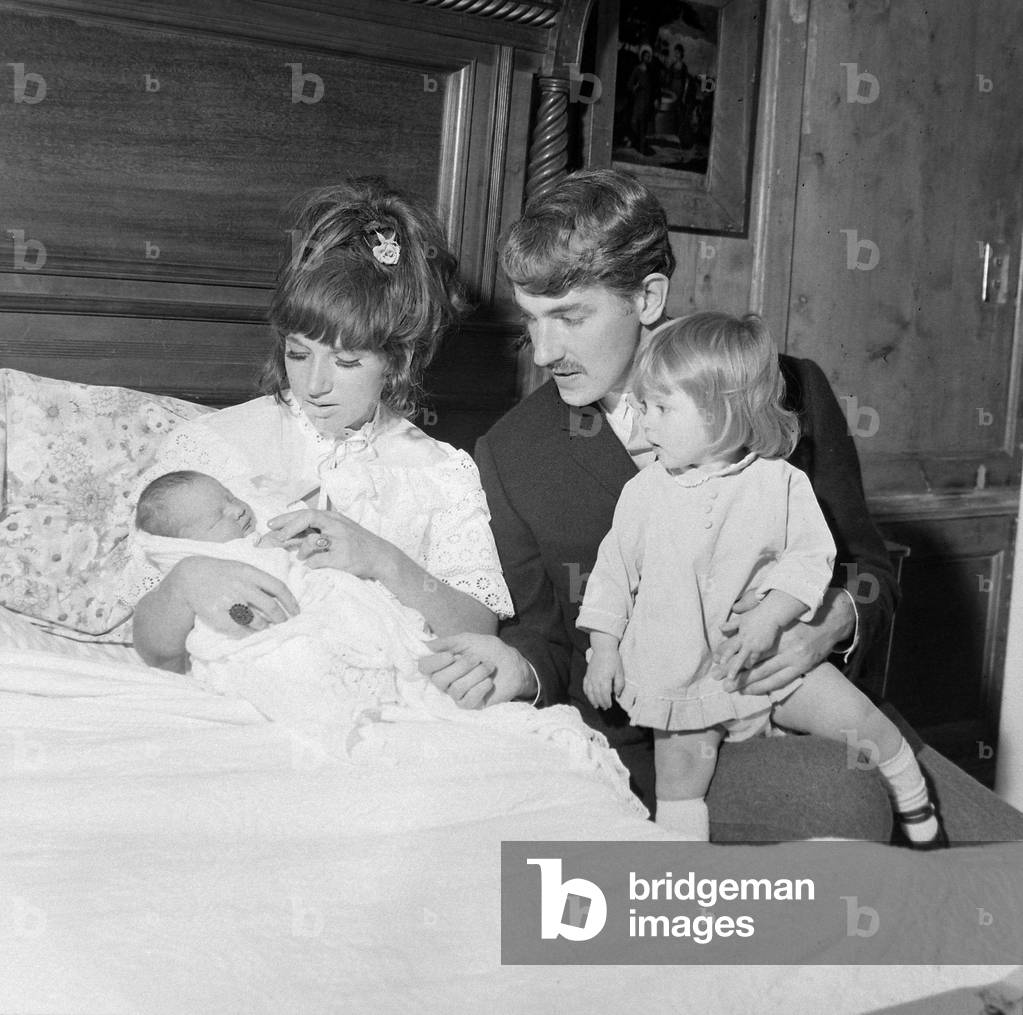 Comedian, actor and publisher Peter Cook with his wife Wendy daughter Lucy and their new born Daisy
September 1965