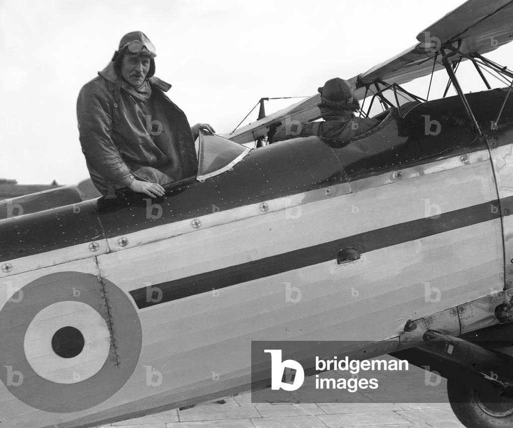 Prime Minister Ramsay MacDonald seen here climbing aboard a Fairey 3F aircraft of number 24 Squadron. The Prime Minister had been attending the Imperial Air Conference at Croydon, before boarding his flight to RAF Halton where he travelled on by car to Chequers. 25th October 1930 (b/w photo)