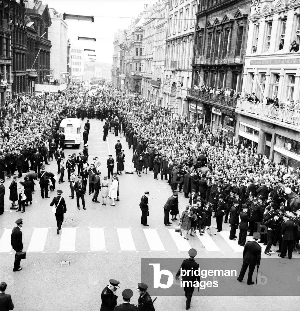 Police try to control fans in the streets of Liverpool before the premiere of the Beatles film 'A Hard Day's Night', 
July 1964