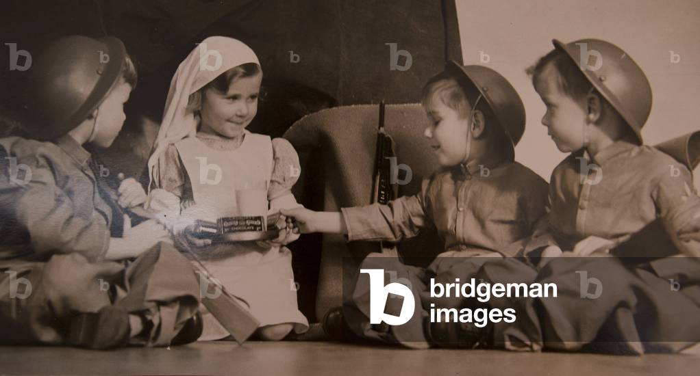 When Ann, Ernest, Michael and Paul Miles were born 1935 they were the first British quadruplets to survive and today they are the world's oldest living quads. Pictured is Ann with old photos of the family. Next year they will overtake a German, now dead, to be the world's oldest quads ever.When Ann, Ernest, Michael and Paul Miles were born 1935 they were the first British quadruplets to survive and today they are the world's oldest living quads. Pictured is Ann with old photos of the family. Next year they will overtake a German, now dead, to be the world's oldest quads ever, 17/11/2014 (photo)
