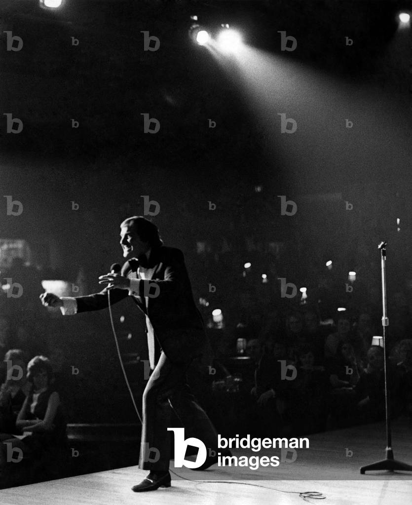 Master funster Bob Monkhouse holds forth on stage at the Wakefield Theatre Club, 14th January 1972 (b/w photo)