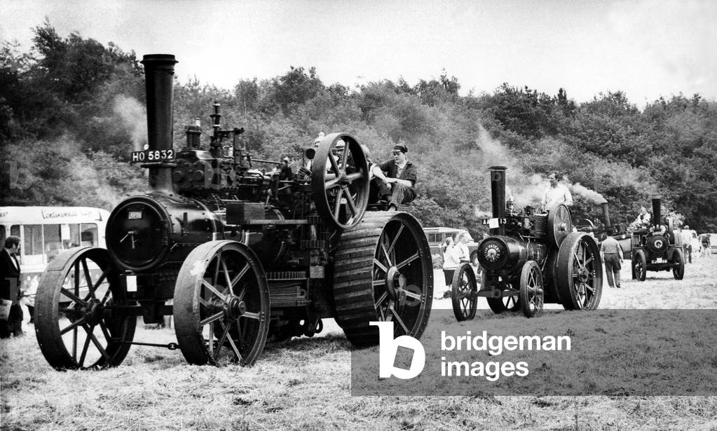 Into the arena come some of the mighty steam giants at the steam traction engine rally near Chester-Le-Street on 10th July 1971 (b/w photo)
