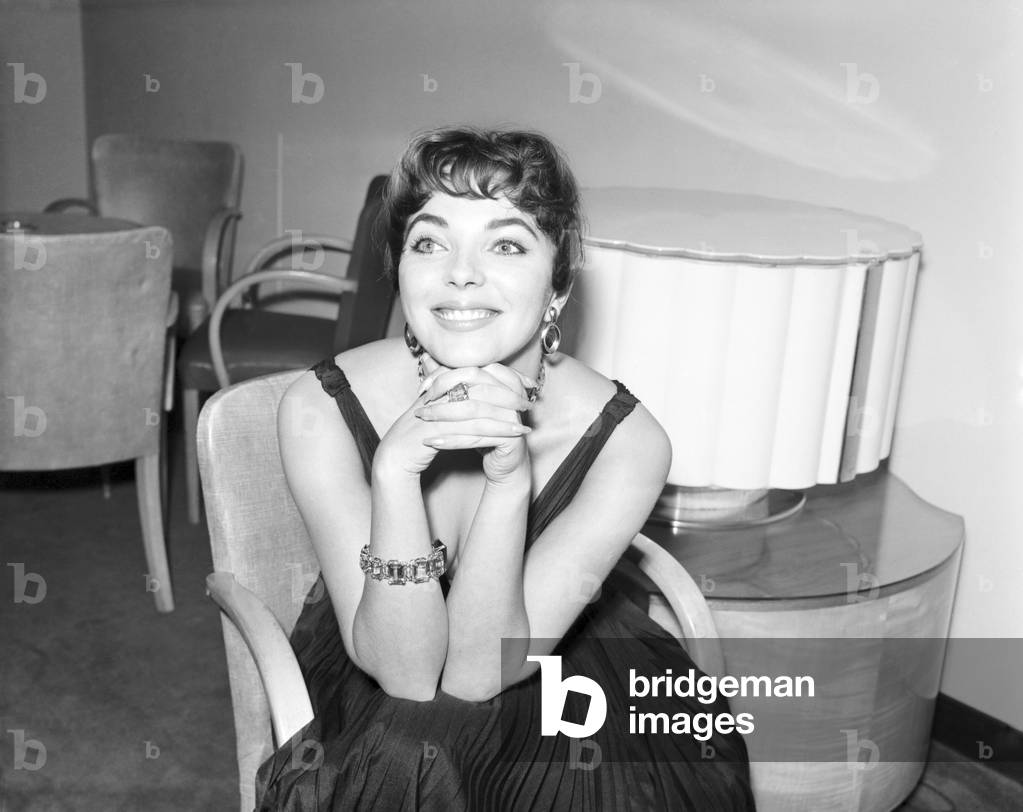 Joan Collins, actress, pictured at home, with family and friends, London, 4th October 1955.