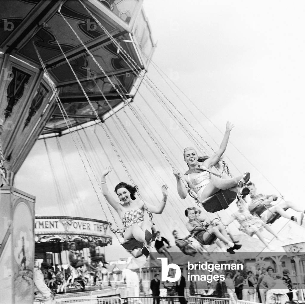 Beauty contest girls at Clacton Butlins on a fairground ride. Clacton-on-Sea, Essex, 19th July 1959 (b/w photo)