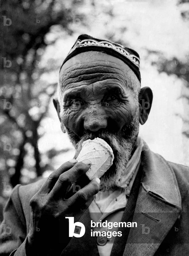A citizen of one of the U.S.S.R.' central states seen here enjoying an ice cream. December 1960