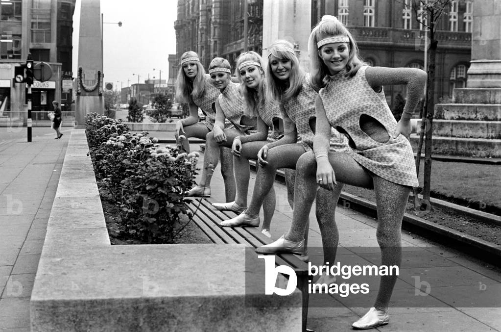 Girls are pictured modelling the usherettes dress of the future designed especially for them by Uniformula of London, a company who make and design uniforms for the Hotel and Cinema trade, October 1969 (b/w photo)