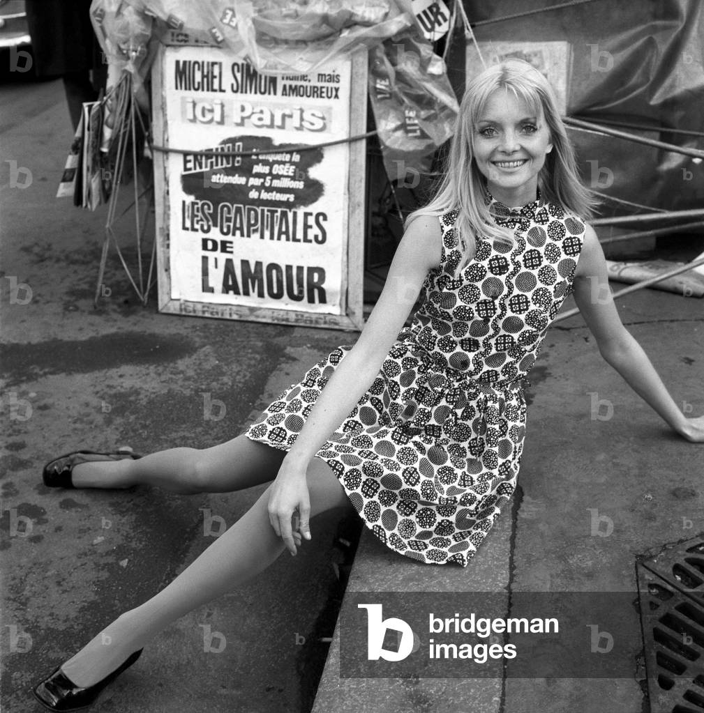 When the Paris fashion shows start a little flowered number like this (right) it could set you back around £300. But this particular printed cotton dress comes from the French chain store, Prisunic, for £3. January 1969 (b/w photo)