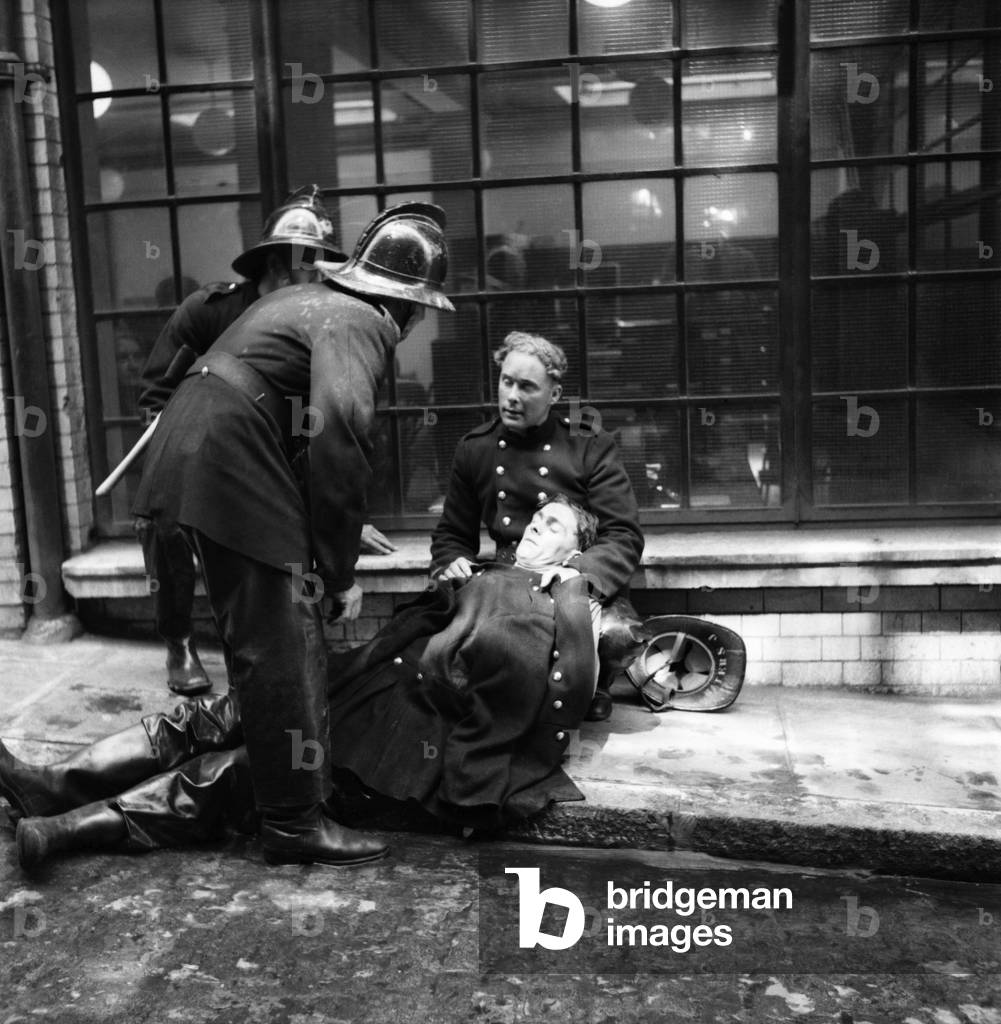 Emergency Services: Five service fireman R. Dastnell is revived by colleagues after fumes from a fire overcome him.