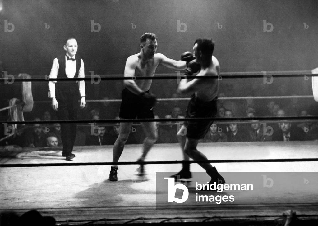 Newcastle's Billy Exley goes to work on Belgian Josef Georeux at the Newcastle St. James' Hall, 15 February 1949 (b/w photo)