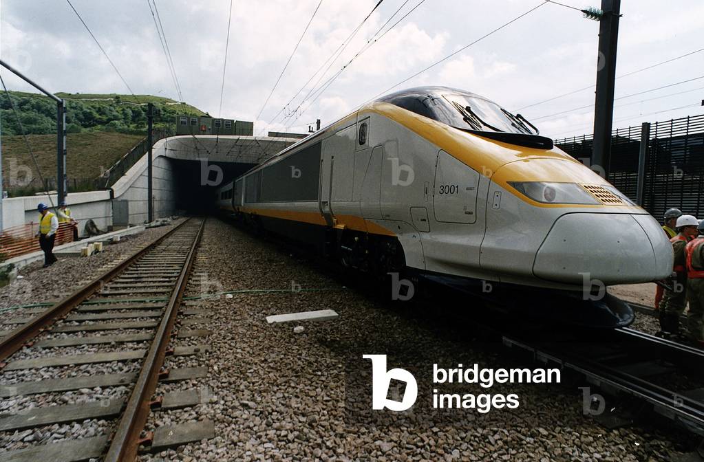 A Eurostar express train emerges from the mouth of the Channel Tunnel on a test run from Folkestone to Calais, 1993 (photo)