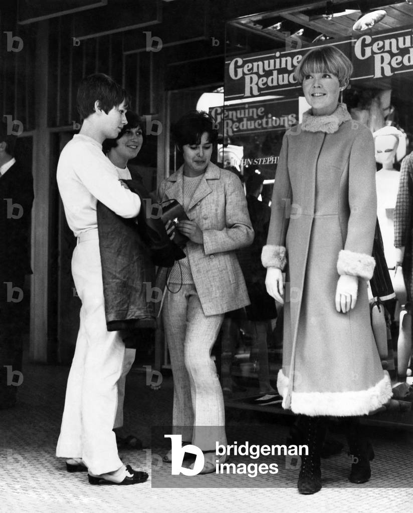 Clothing Fashion 1966: Jean Jobson wearing the latest length Paris coat. August 1966 (b/w photo)